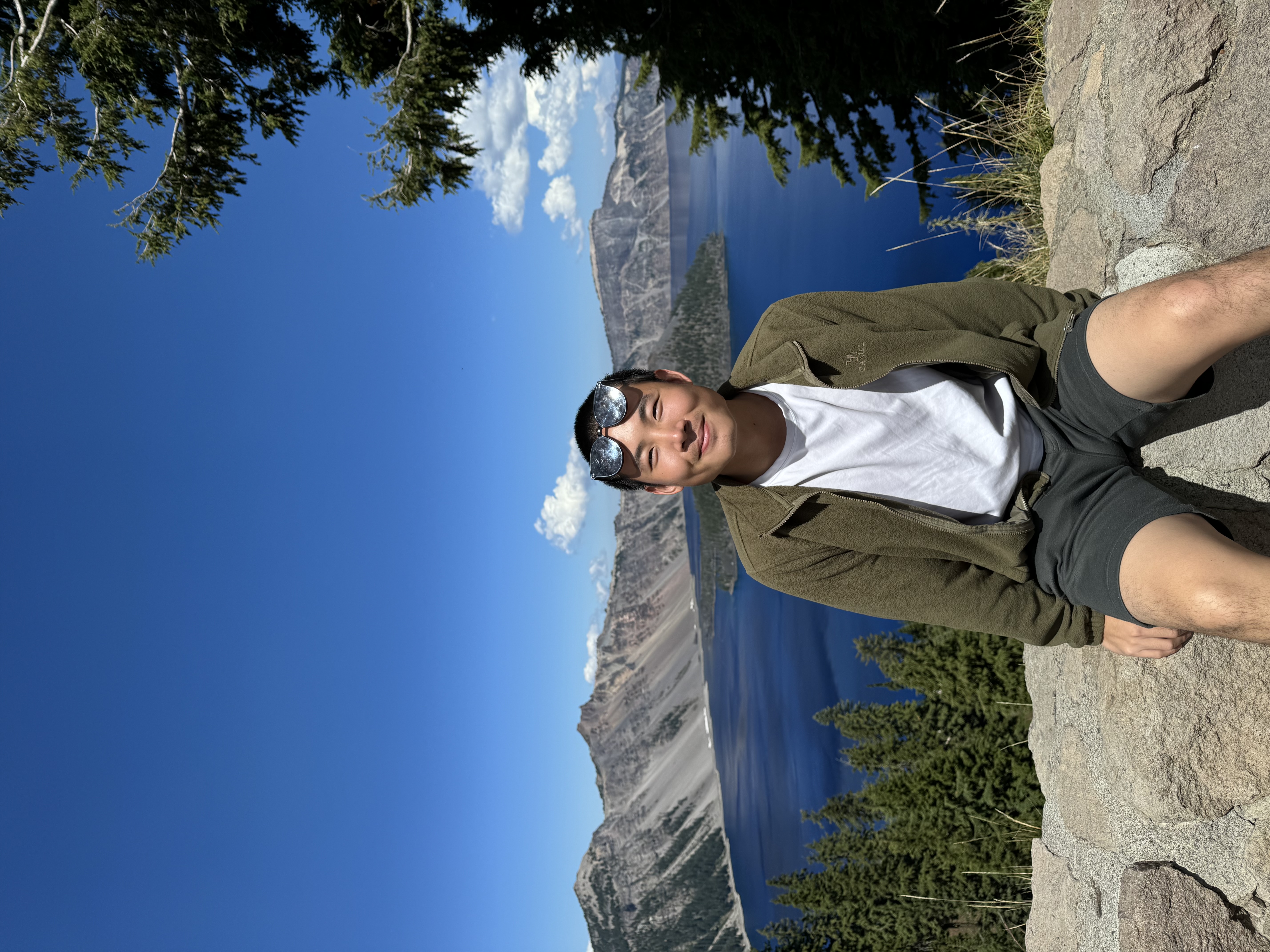 Smiling at Crater Lake with the deep blue caldera in the background