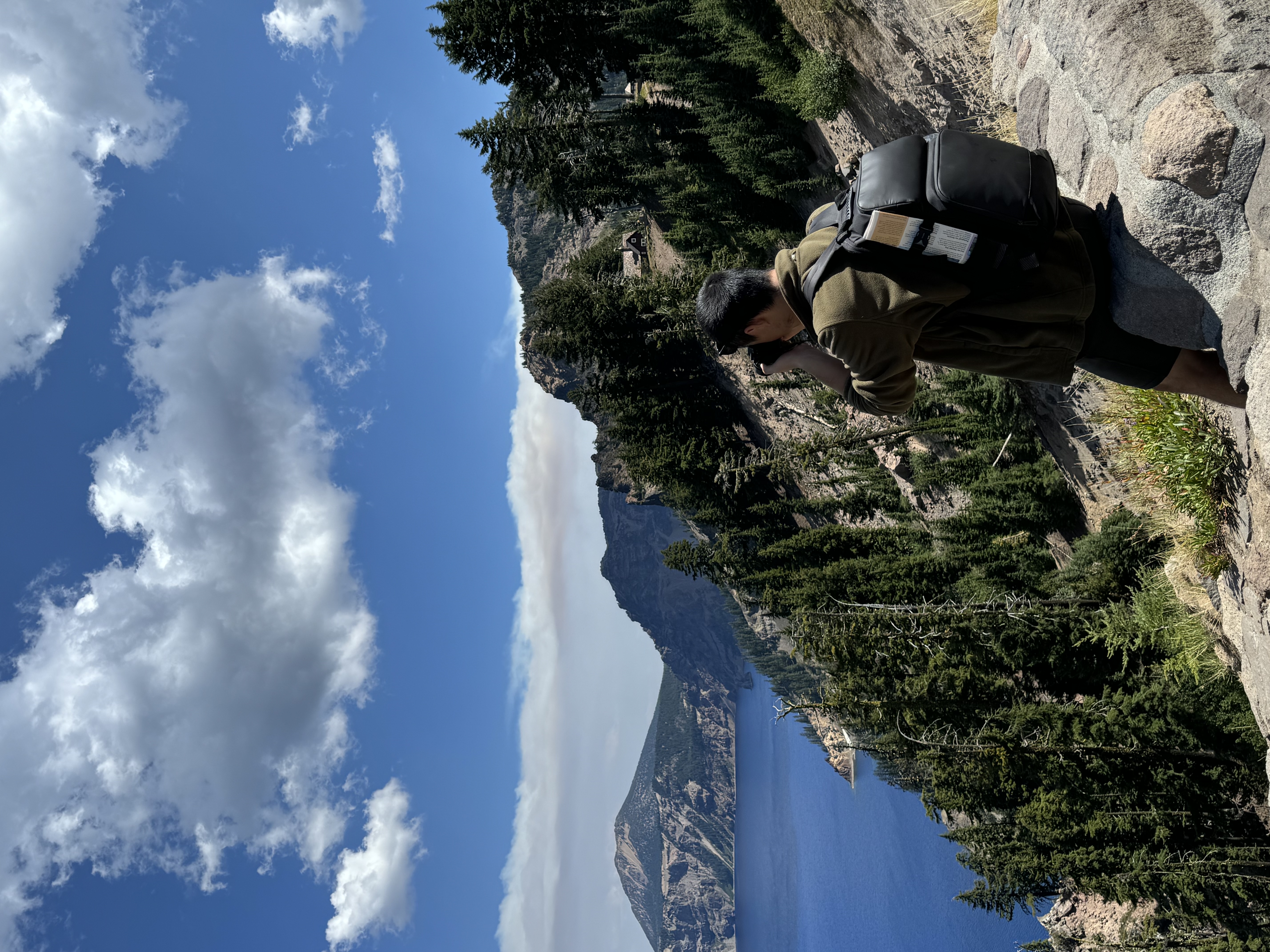 Photographing the rim of Crater Lake from a rocky overlook
